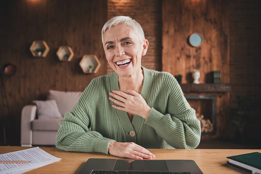 A happy senior woman with short grey hair