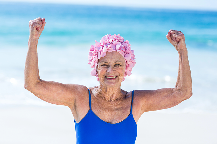 Pretty mature woman showing her muscles