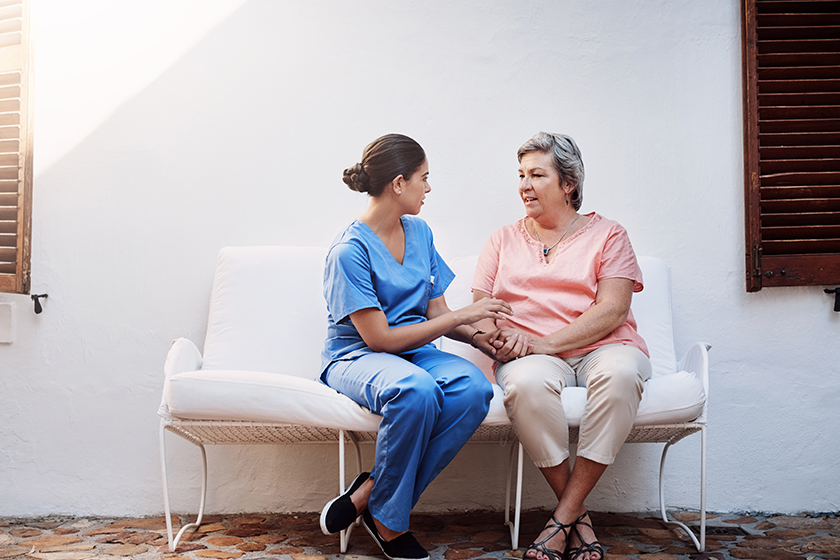 holding-hands-caregiver-senior-woman-outdoor-therapy