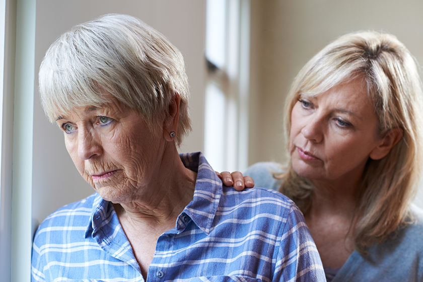 serious-senior-woman-with-adult-daughter